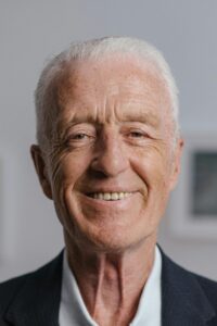 An Elderly Man in Black Suit Smiling